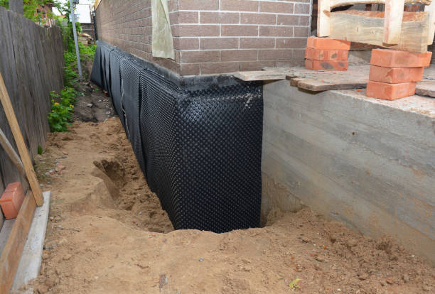 SJ Waterproofing Pros technician performing targeted Waterproofing assessment in Gwynneville, IN